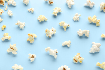 Delicious popcorn on blue background