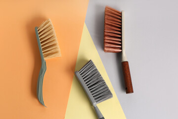 Set of cleaning brushes on color background
