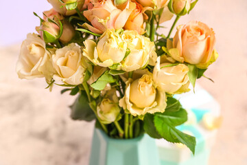 Vase with bouquet of beautiful rose flowers, closeup