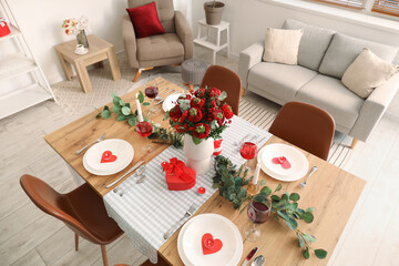 Table setting for Valentine's Day with beautiful flowers in dining room