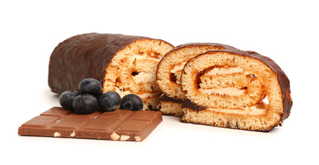 Pieces of tasty sponge cake roll, chocolate and blueberry on white background