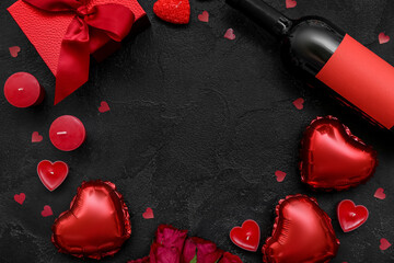 Frame made of candles, balloons and wine on dark background. Valentine's Day celebration