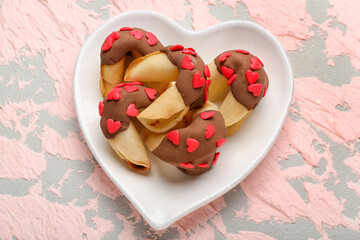 Plate with fortune cookies on grunge background. Valentine's Day celebration