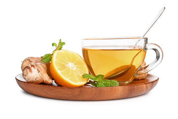 Wooden board with ginger roots, lemon, mint and cup of tea isolated on white background