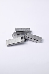 Pile of metal staples for stapler isolated on white background