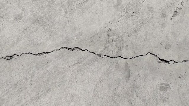 Road surfaces from cracked cement or damaged by earthquakes or prolonged use.