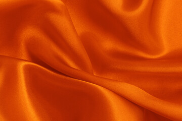 Orange fabric cloth texture for background and design art work, beautiful crumpled pattern of silk...