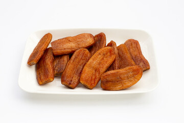 Sun dried bananas on white background.