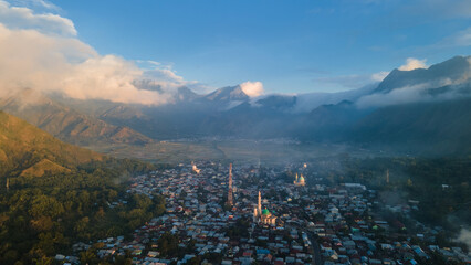Aerial view of some agricultural fields in Sembalun. Sembalun is situated on the slope of mount Rinjani and is surrounded by beautiful green mountains. Sembalun, Lombok, West Nusa Tenggara, Indonesia.