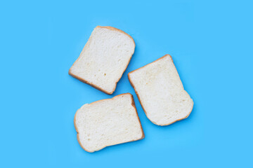 Sliced bread on blue background.