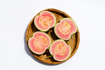 Fresh pink guava on white background.