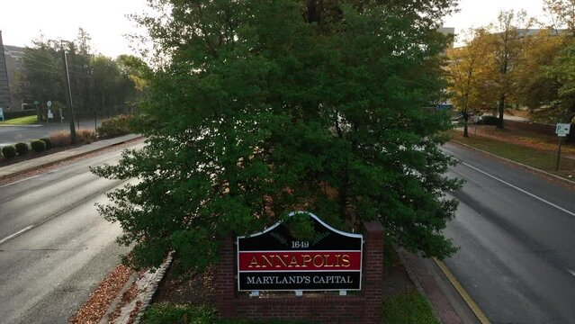 Welcome to Annapolis Maryland sign. Rising aerial reveals autumn fall foliage in MD state capital.