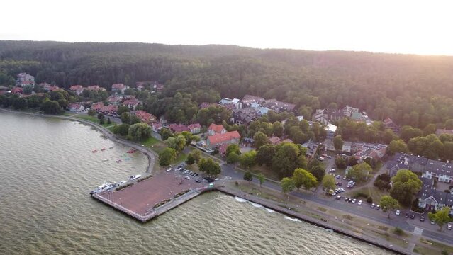 AERIAL Ascending Shot of the Resort Town Juodkrante and its Harbor in Curonian Spit National Park, Lithuania