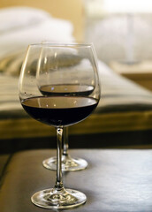 glasses of red wine in hotel room
