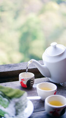 tea leaves,Tea plantation field scenery,Cup of hot tea,hot herbal tea with mint in a glass bowl