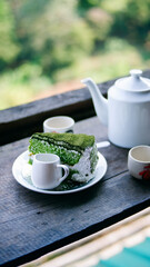 tea leaves,Tea plantation field scenery,Cup of hot tea,hot herbal tea with mint in a glass bowl,cake