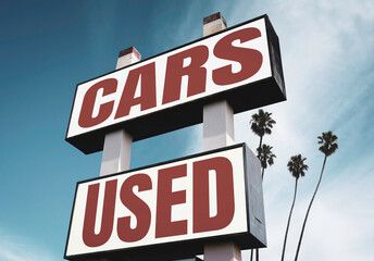 Vintage used cars for sale sign with palm trees