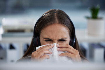 Sick, tissue and call center woman employee working and blowing nose at a telemarketing job. Customer support, b2b sales worker and contact us business person with virus or allergy at the office