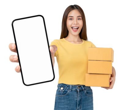 Smiling beautiful Asian woman holding cardboard boxes and hands show smartphone mockup of blank screen on PNG transparent background. Take your screen to put on advertising. Concept delivery online.
