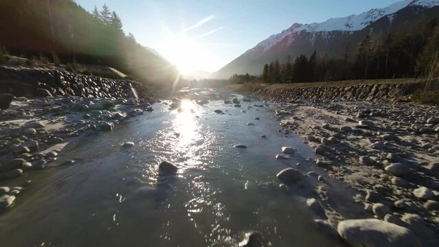 River Arve near Chamonix France with low water level and stone bed showing, Flyover FPV drone view