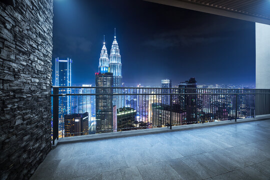 Modern balcony with cityscape night view. 3D rendering