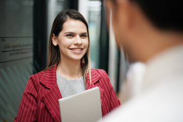 Smiling businesspeople having a discussion in an office