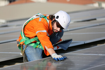 Professional worker installing solar panels on the roof. engineer working on checking equipment in solar power plant, Pure energy, Renewable energy.