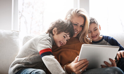 Relax, tablet and mom with children on sofa bonding, quality time and streaming movies on weekend. Love, family home and mom and kids with digital tech for online games, learning and internet app