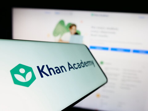 Stuttgart, Germany - 01-14-2023: Mobile phone with logo of non-profit education company Khan Academy Inc. on screen in front of website. Focus on center-left of phone display.