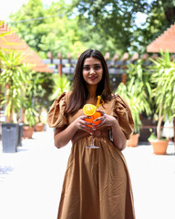 Fototapeta premium Travel, coffee, leisure, lifestyle and people concept -beautiful lady in a restaurant. portrait of a beautiful young woman 