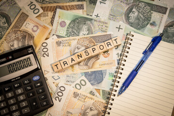 transport cost increase in poland, spelled word, money, calculator and pen