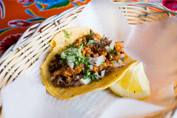 Pork tacos. A taco is a traditional Mexican food consisting of a small hand-sized corn tortilla