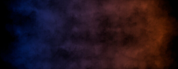 Smoke clouds with color gradient from blue to orange isolated on black background. Interesting background with space for your design.