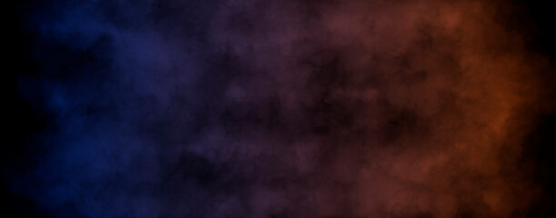 Smoke clouds with color gradient from blue to orange isolated on black background. Interesting background with space for your design.
