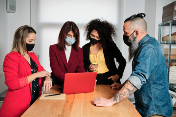 Business People with face mask having a meeting in the office.