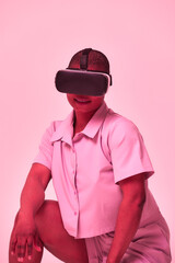 A cheerful girl in virtual reality glasses. Blue and purple colors.