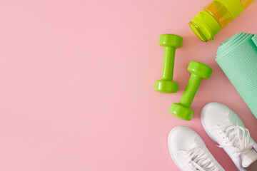 Active living concept. Flat lay photo of green dumbbells, white sneakers, bottle of water and...