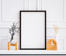 PSD Photo Frame Mockup On Table With Twig and Wooden Clock Living Room Decoration White Wall