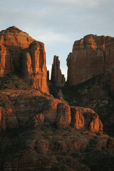 Tight shot zoomed in photograph of Cathedral rock in Sedona Arizona showing more detail of the red rock at sunset in the month of January.