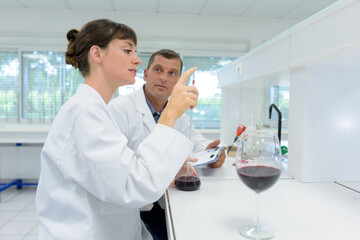 experts making tests in winery laboratory