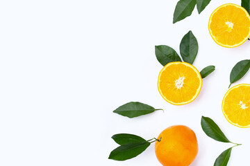 Orange fruit with green leaves on white background.