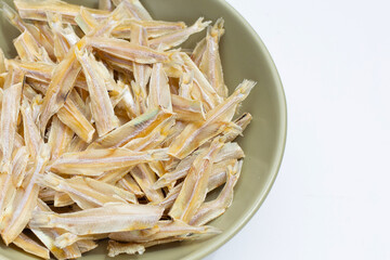 Dried anchovy on white background.