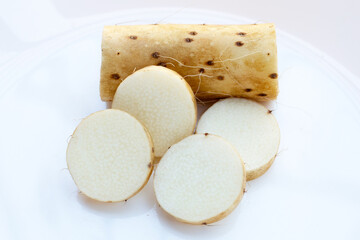 Fresh nagaimo on white background.