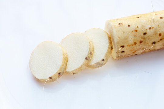 Fresh nagaimo on white background.