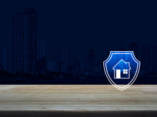 House with shield flat icon on wooden table over modern office city tower and skyscraper, Business home insurance and security concept