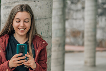 student at school looking at mobile phone