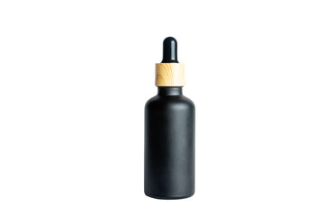 A dropper bottle with serum or gel isolated on white background. Beauty concept for face and body care. Skincare products, natural cosmetic. Black matte glass package