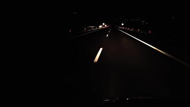 Pov drive at empty highway line at night
