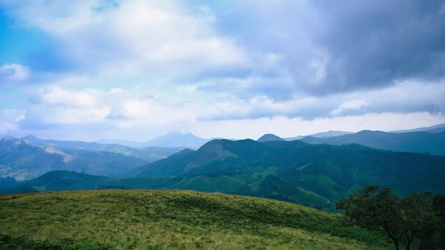 HDR Timelapse footage of Eravikulam National Park showing greenery and moving clouds near hills of western ghat 