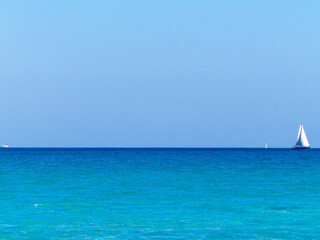 A boat in the turquoise waters of the Mediterranean Sea.